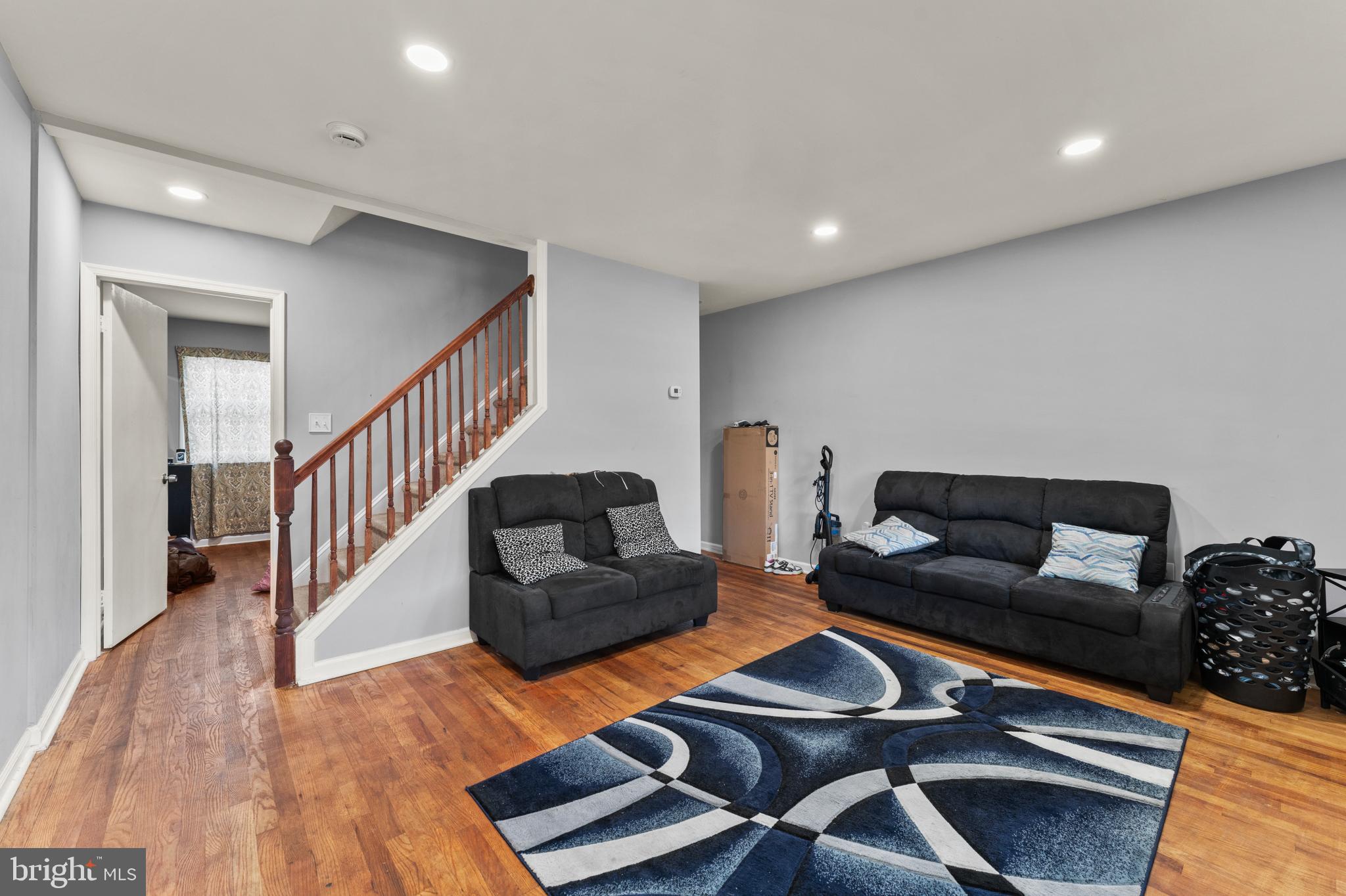 8146 Gray Haven Road Dundalk, MD 21222 - Photo 4 of 18 a living room with furniture and stairs