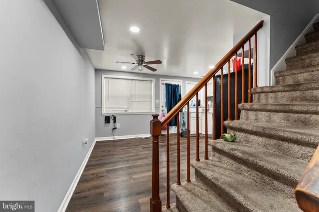 a kitchen with stainless steel appliances granite countertop a refrigerator and a stove