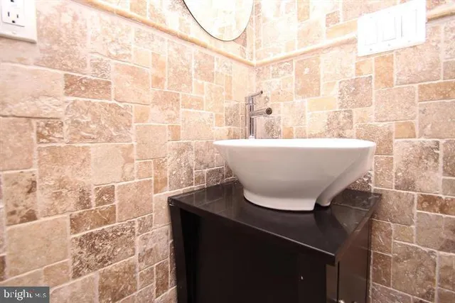 a white bath tub sitting in a bathroom