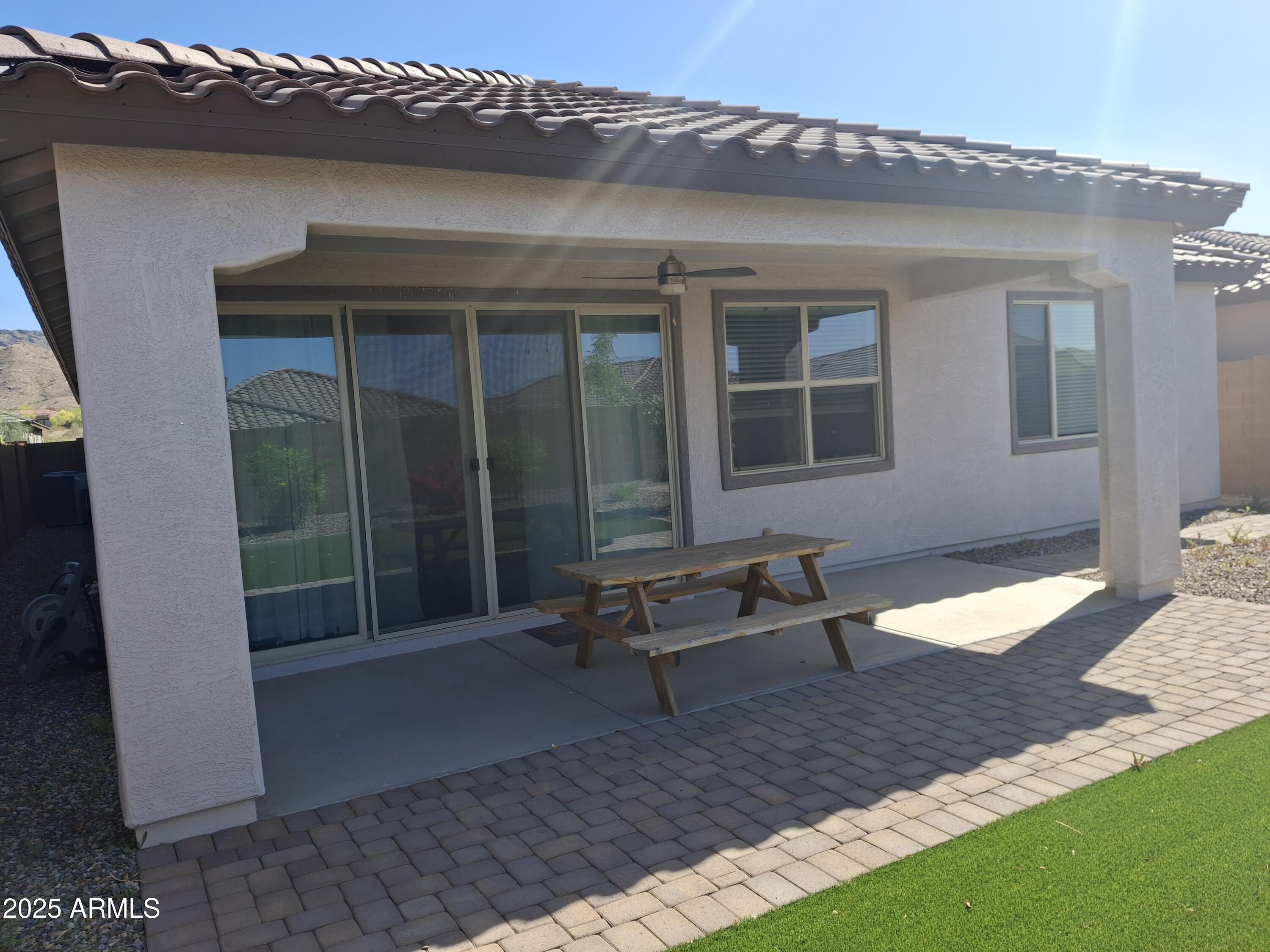 1536 West Corral Road Phoenix, AZ 85041 - Photo 14 of 16 a view of house with backyard and outdoor seating