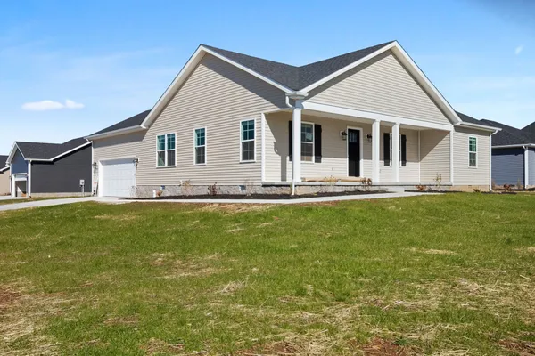 a front view of house with garden