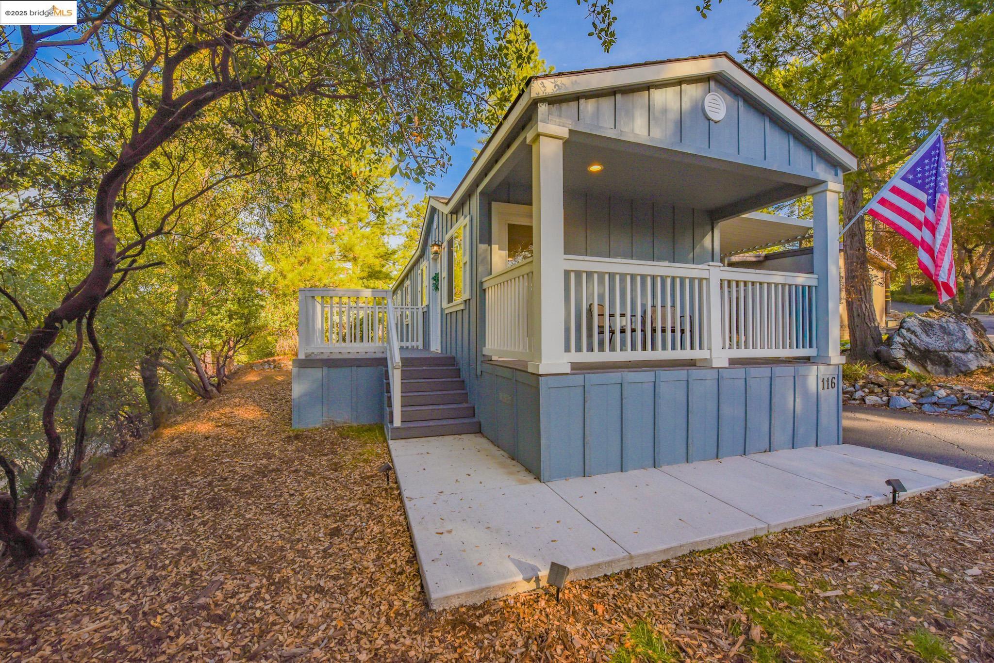 10956 Green Street Columbia, CA 95310 - Photo 31 of 45 View of front of house featuring covered porch and board and batten siding