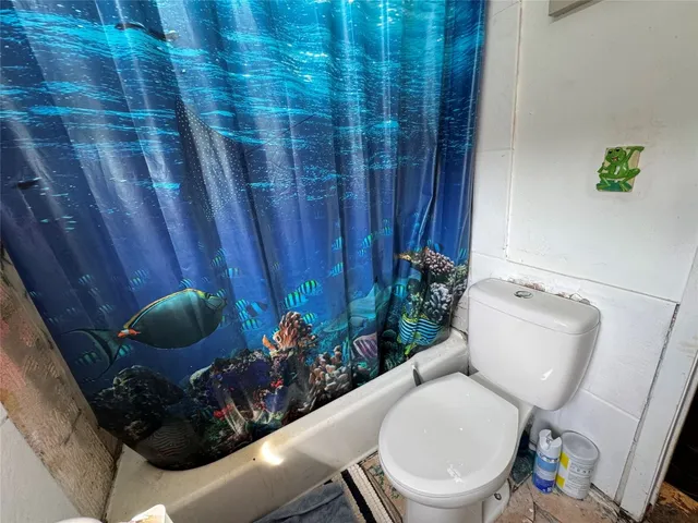 a bathroom with a toilet and a sink