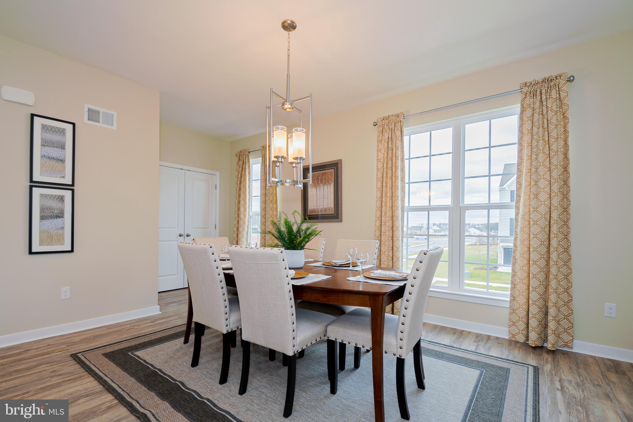 199 Case Road Townsend, DE 19734 - Photo 7 of 18 a view of a dining room with furniture window and wooden floor