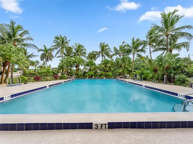 a view of swimming pool from a balcony