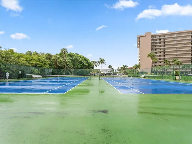 a view of an outdoor space and tennis court