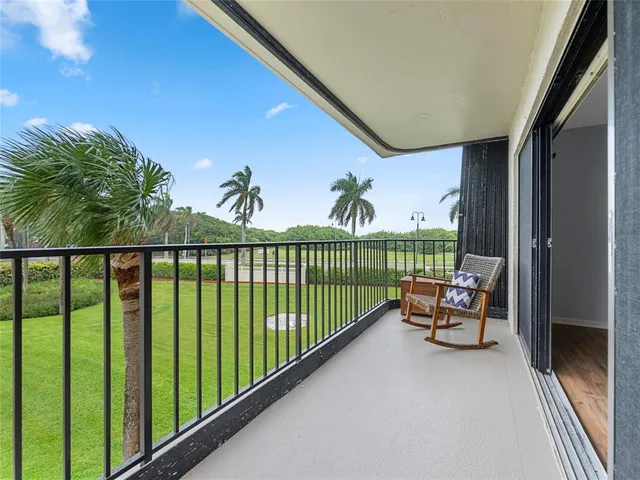 a view of a balcony with furniture