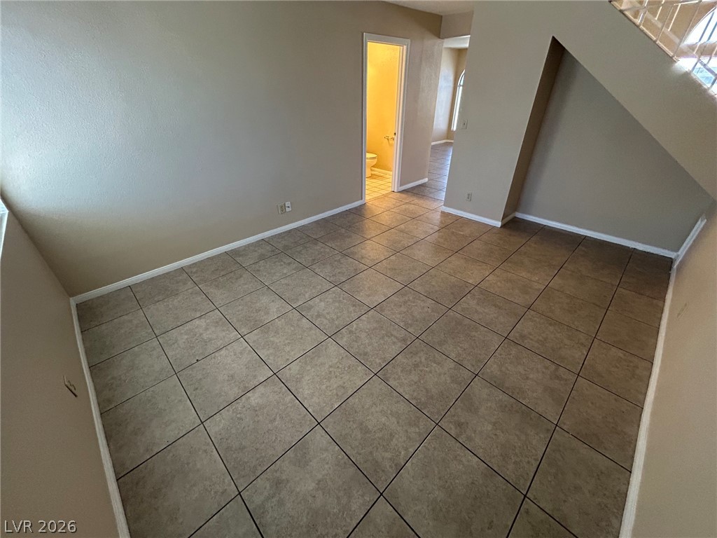 2806 Rungsted Street Las Vegas, NV 89142 - Photo 14 of 18 Functional ceramic tile flooring extends throughout this versatile living space, awaiting your personal touch.