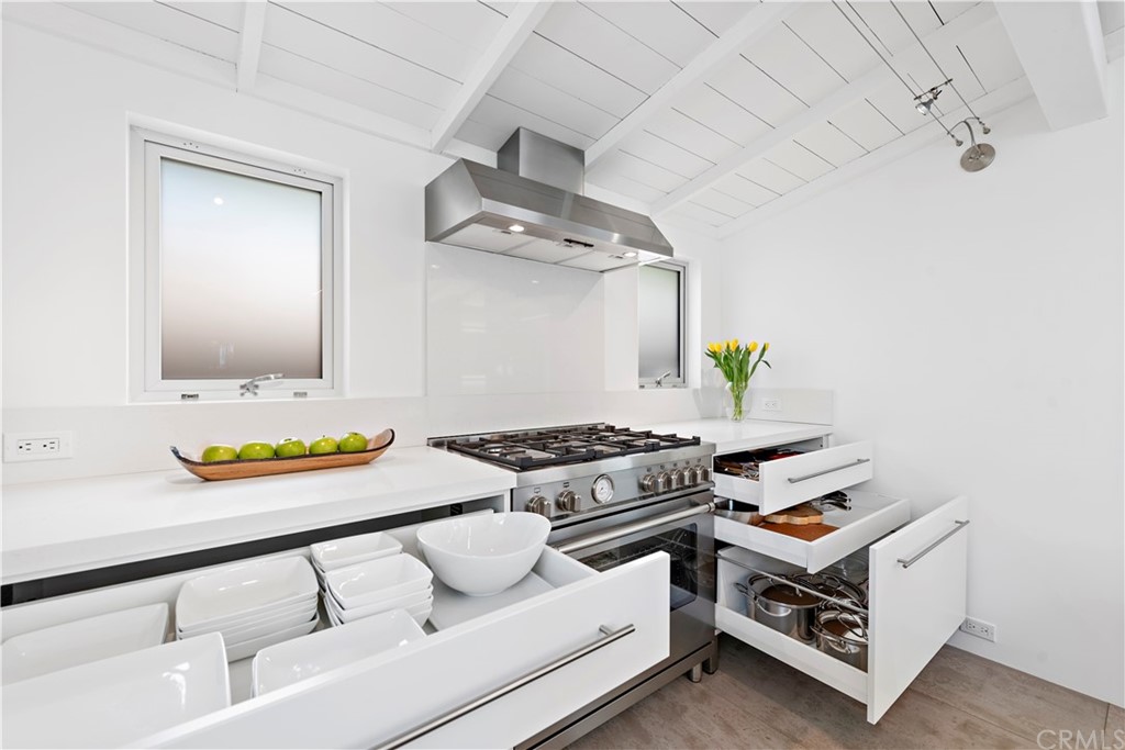 239 Fairview Street Laguna Beach, CA 92651 - Photo 23 of 67 a kitchen with stainless steel appliances granite countertop a stove and a sink