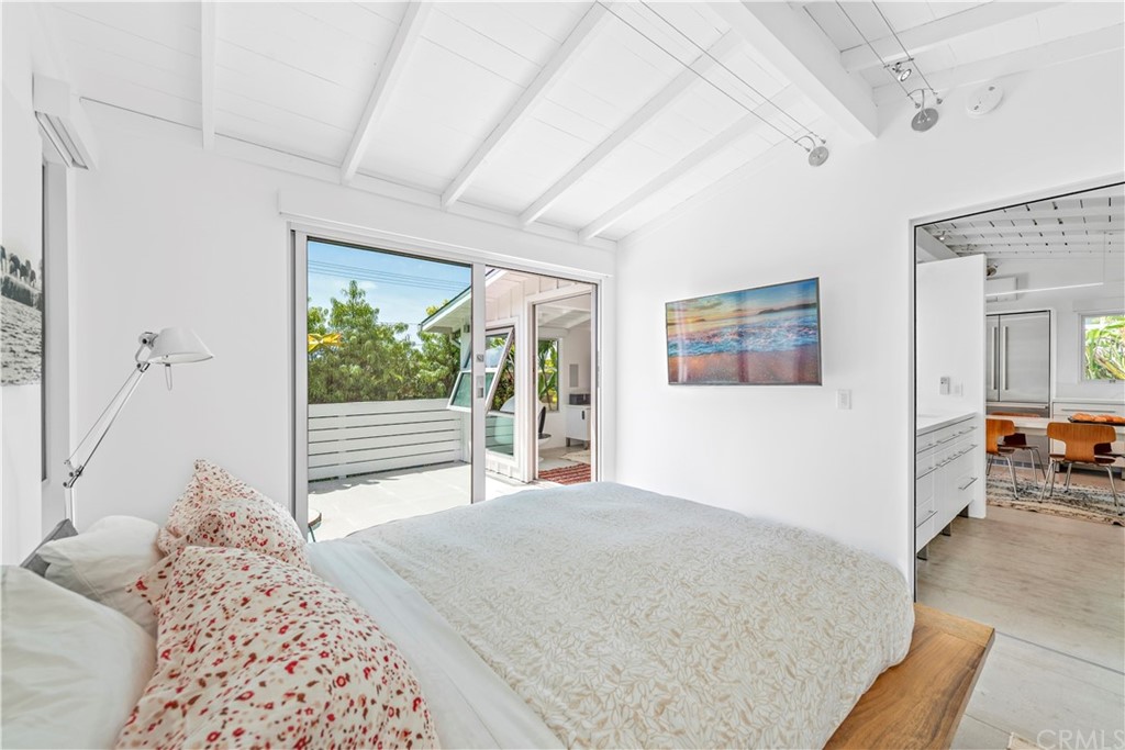 239 Fairview Street Laguna Beach, CA 92651 - Photo 27 of 67 a bedroom with a large bed and a window