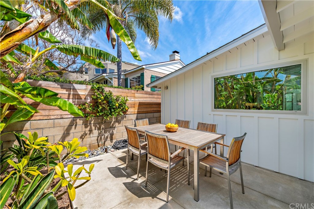 239 Fairview Street Laguna Beach, CA 92651 - Photo 38 of 67 a view of a patio with table and chairs and potted plants