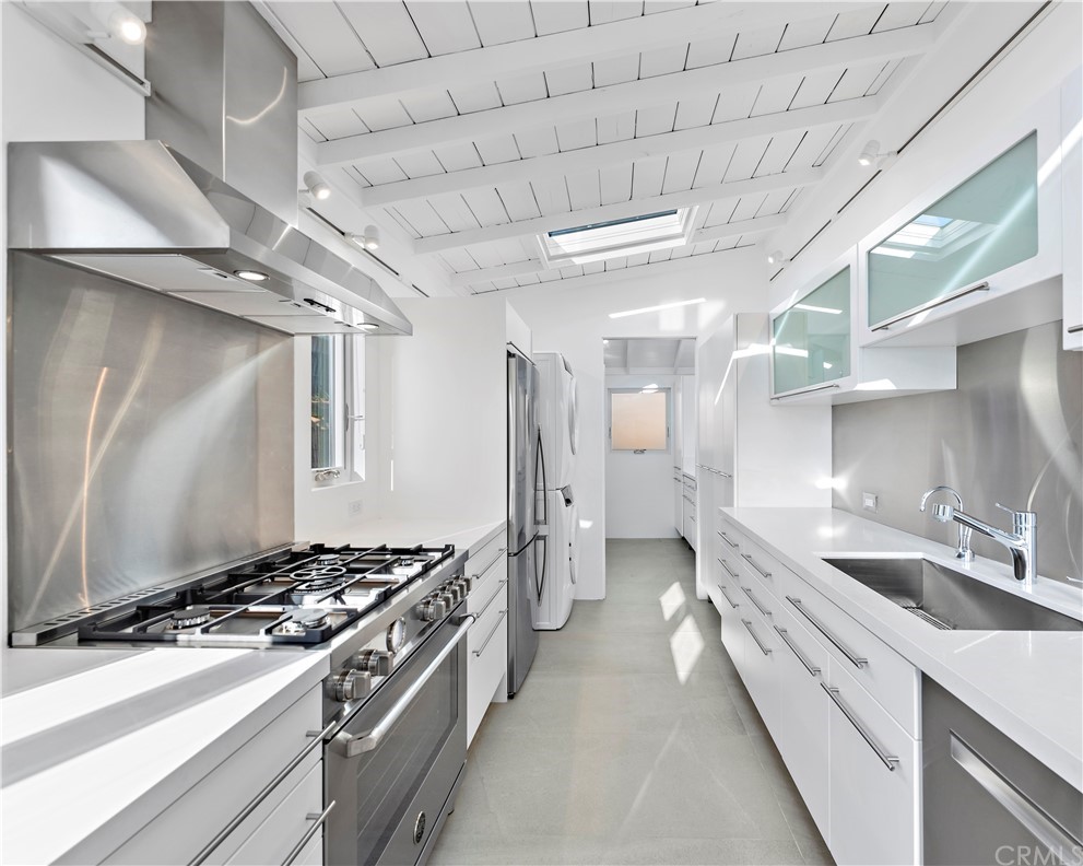 239 Fairview Street Laguna Beach, CA 92651 - Photo 56 of 67 a kitchen with stainless steel appliances granite countertop a sink and a stove