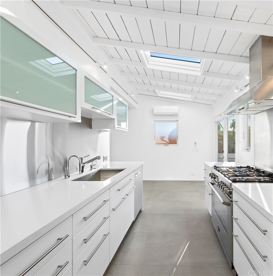 239 Fairview Street Laguna Beach, CA 92651 - Photo 57 of 67 a kitchen with stainless steel appliances granite countertop a sink and cabinets