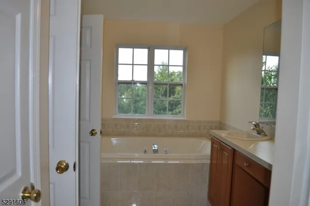 a bathroom with a bathtub and sink