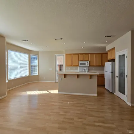 a view of kitchen with wooden floor