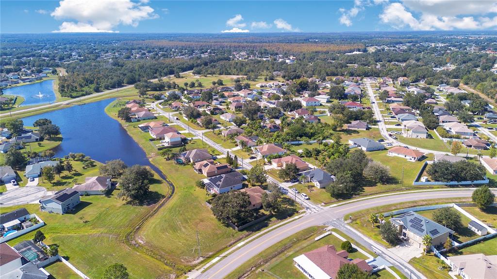 887 Adour Drive Kissimmee, FL 34759 - Photo 14 of 16 an aerial view of residential houses with outdoor space