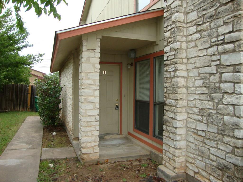 2804 Bull Run, Unit B Taylor, TX 76574 - Photo 2 of 9 a front view of a house with a garden