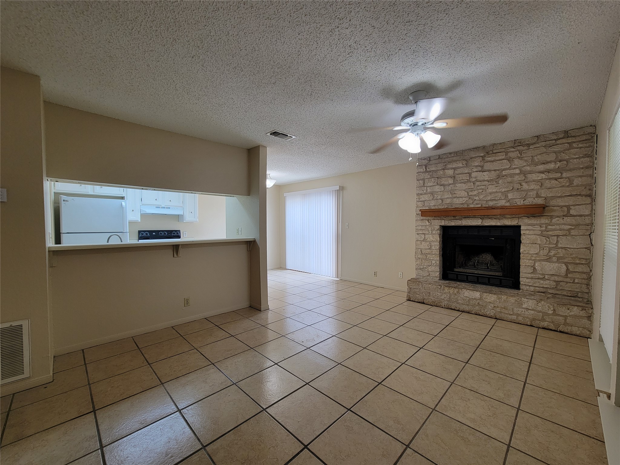 2804 Bull Run, Unit B Taylor, TX 76574 - Photo 3 of 9 a view of a kitchen with a stove cabinets and a kitchen counter top