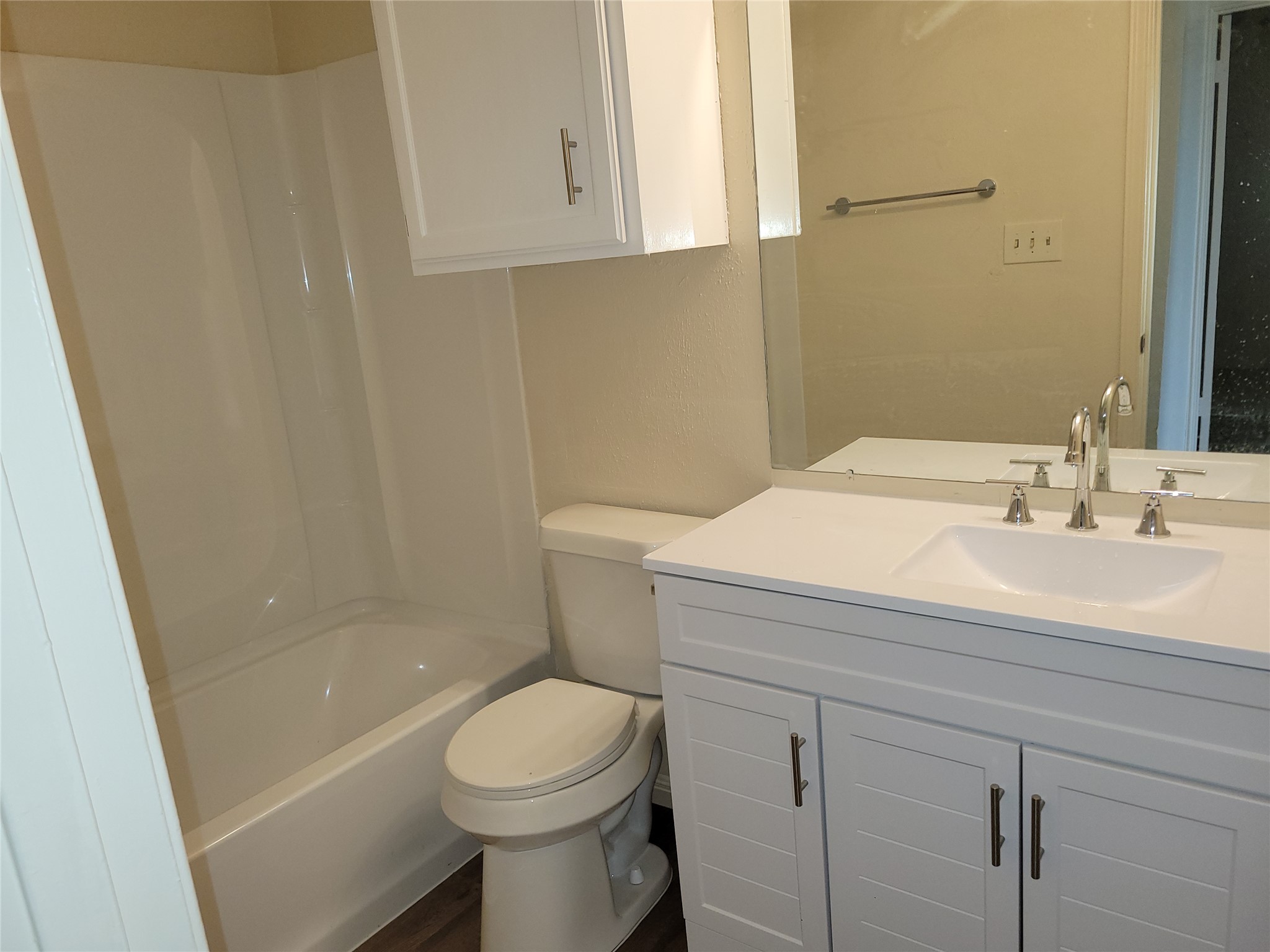 2804 Bull Run, Unit B Taylor, TX 76574 - Photo 7 of 9 a bathroom with a sink a toilet and shower