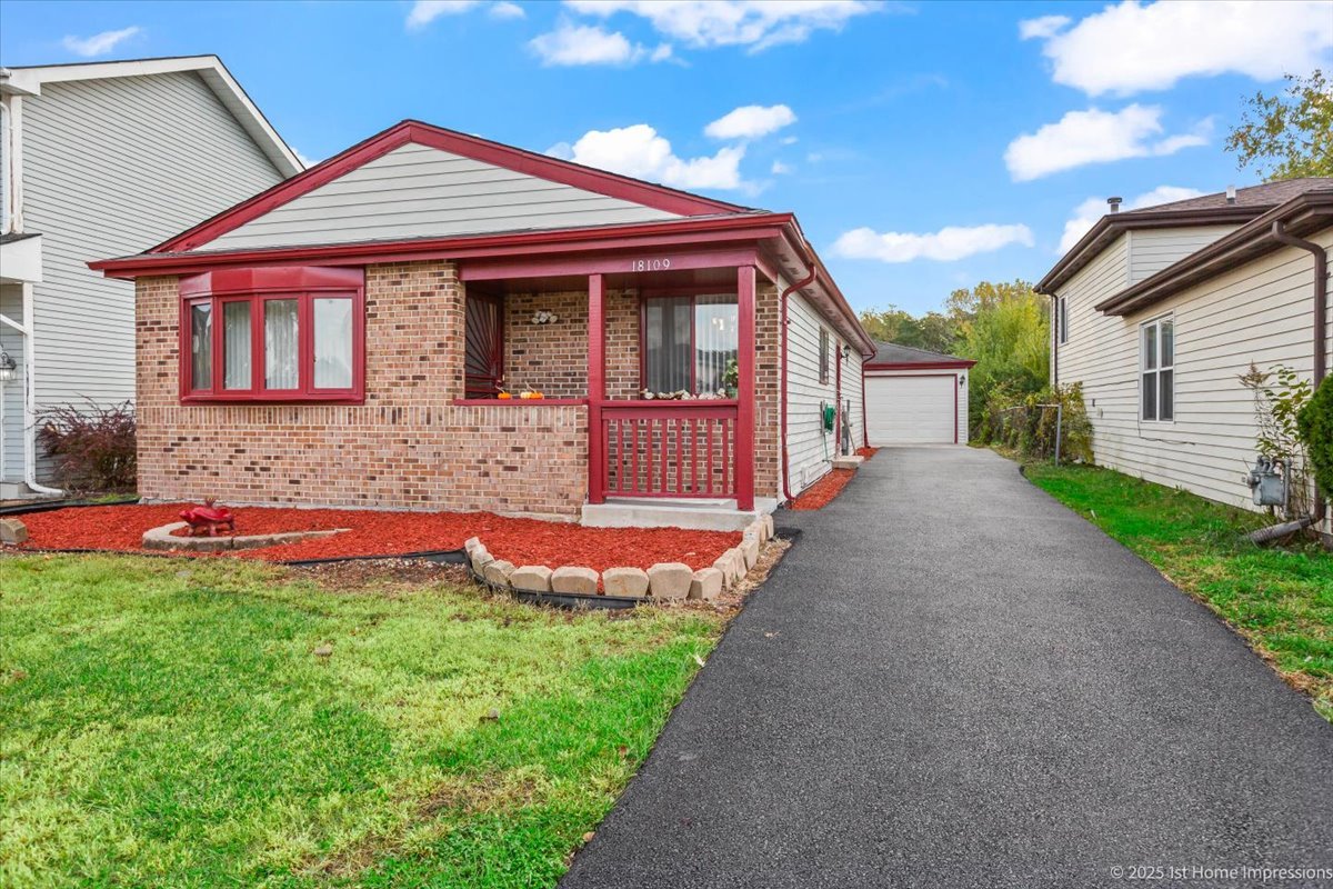 18109 Idlewild Drive Country Club Hills, IL 60478 - Photo 1 of 21 a front view of a house with yard and porch