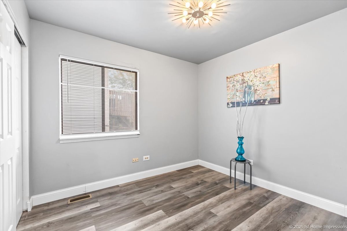 18109 Idlewild Drive Country Club Hills, IL 60478 - Photo 14 of 21 a bathroom with a granite countertop sink and a window