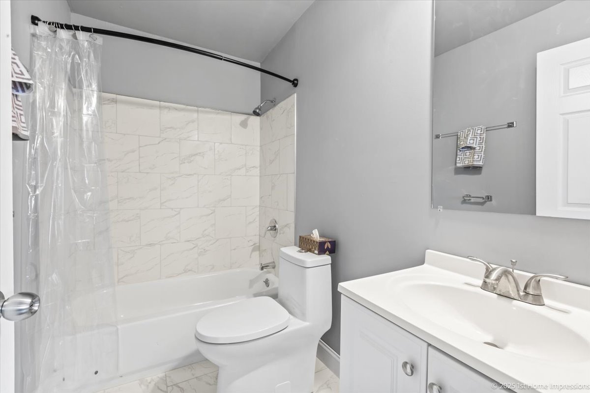 18109 Idlewild Drive Country Club Hills, IL 60478 - Photo 16 of 21 a bathroom with a sink a toilet and shower