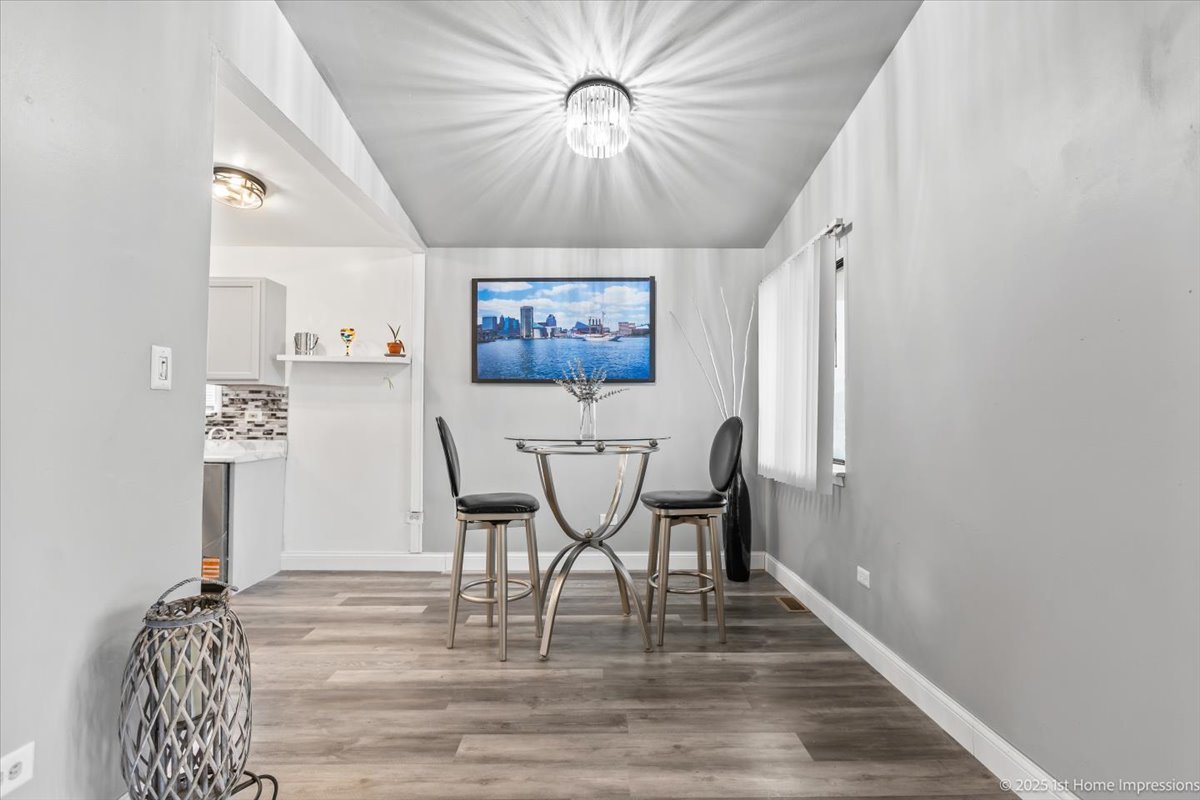 18109 Idlewild Drive Country Club Hills, IL 60478 - Photo 6 of 21 a view of a dining room with furniture and wooden floor