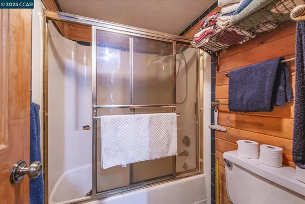 a bathroom with a shower and a sink