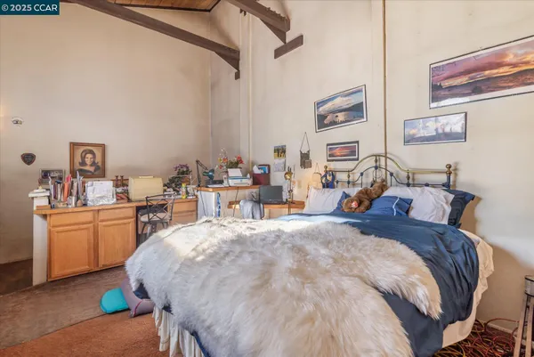 a bed room with a bed and furniture