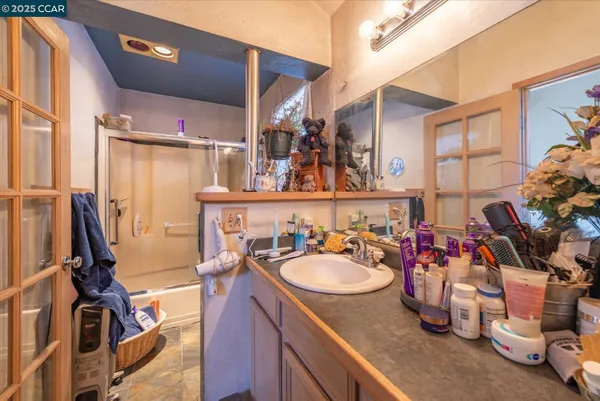 a bathroom with a sink double vanity and a tub