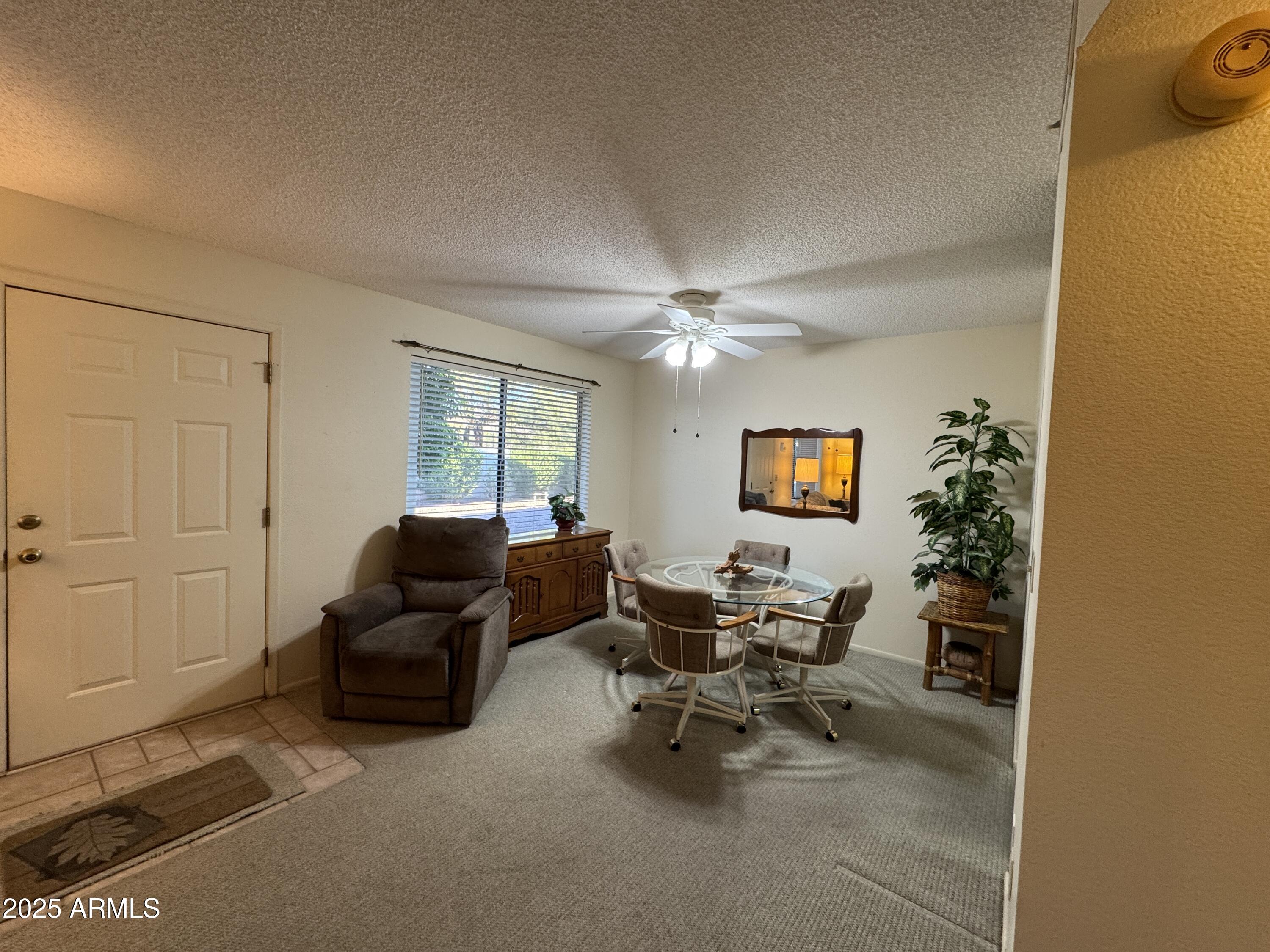 3270 South Goldfield Road, Unit 304 Apache Junction, AZ 85119 - Photo 8 of 35 Full Dining area and front door
