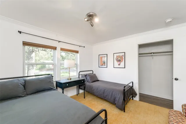 a bedroom with furniture and a window