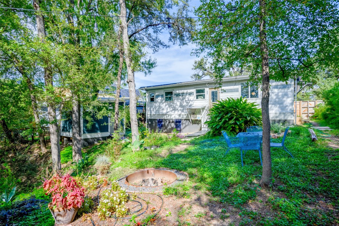 5323 Downs Drive Austin, TX 78721 - Photo 24 of 28 a view of backyard with plants and outdoor seating