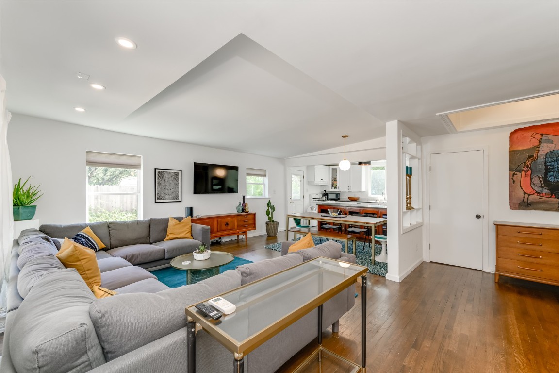 5323 Downs Drive Austin, TX 78721 - Photo 8 of 28 a living room with furniture and a flat screen tv