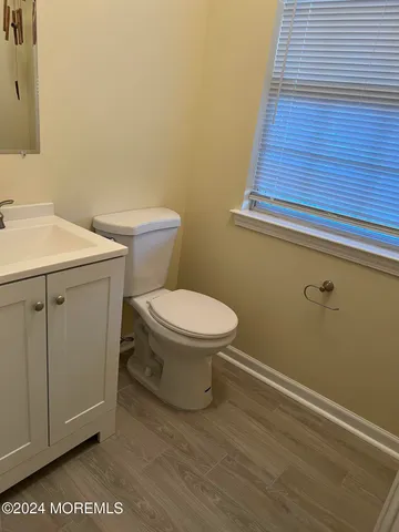 a bathroom with a toilet and a sink