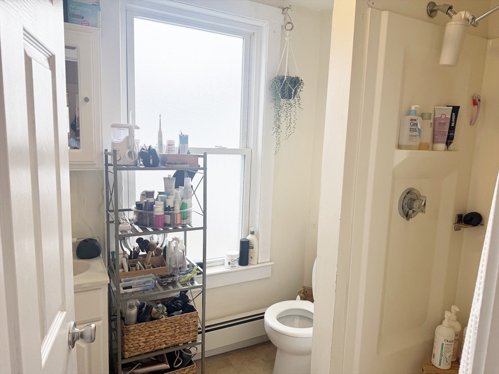 37 Prospect St Avenue, Unit 2 Waltham, MA 02453 - Photo 11 of 14 a bathroom with a toilet and a shower