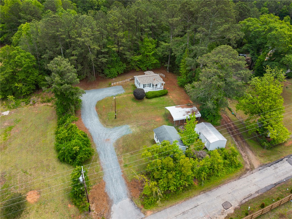 111 State Rd S-4-104 Anderson, SC 29626 - Photo 27 of 42 This tranquil property offers a serene retreat surrounded by lush greenery and expansive outdoor space.