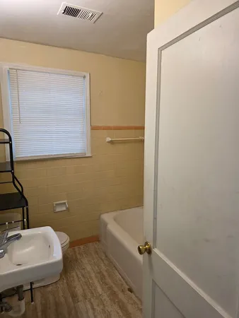 a bathroom with a sink and mirror