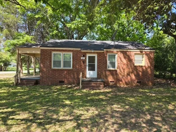 front view of a house with a big yard