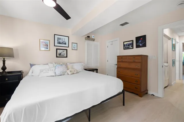 a bedroom with a bed and a dresser