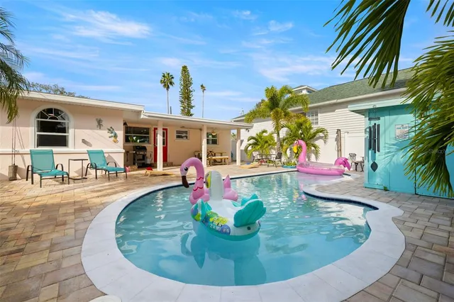 a view of a porch with potted plants