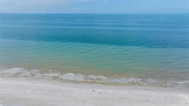 an aerial view of a houses with a lake view