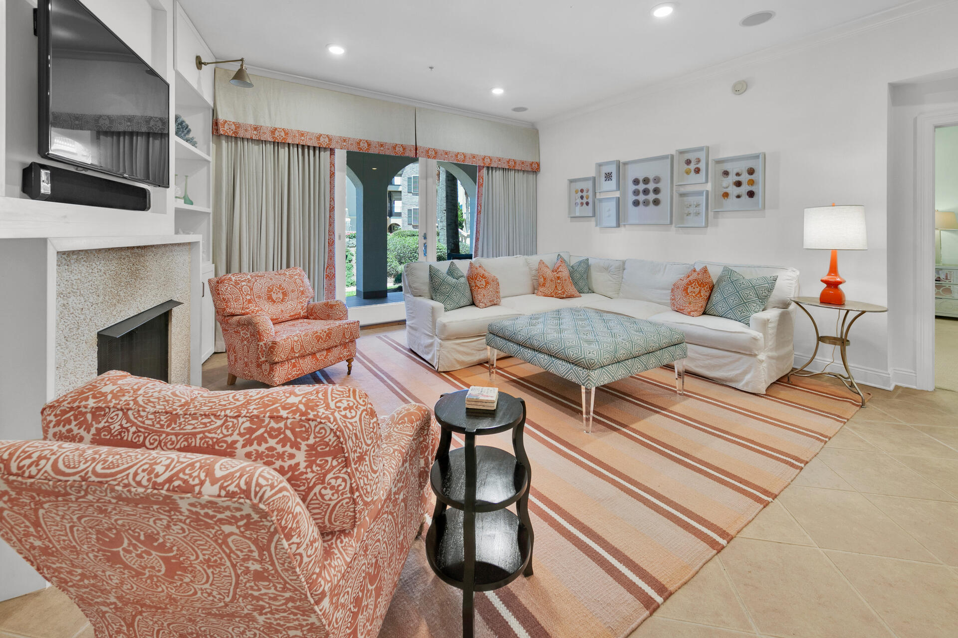 56 Blue Mountain Road, Unit B105 Santa Rosa Beach, FL 32459 - Photo 2 of 49 a living room with furniture a flat screen tv and a fireplace