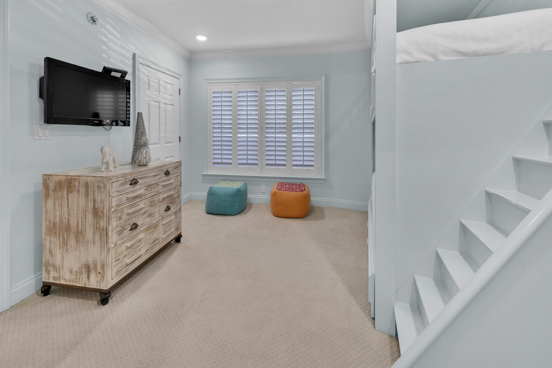 56 Blue Mountain Road, Unit B105 Santa Rosa Beach, FL 32459 - Photo 25 of 49 a spacious bedroom with a bed and a flat screen tv