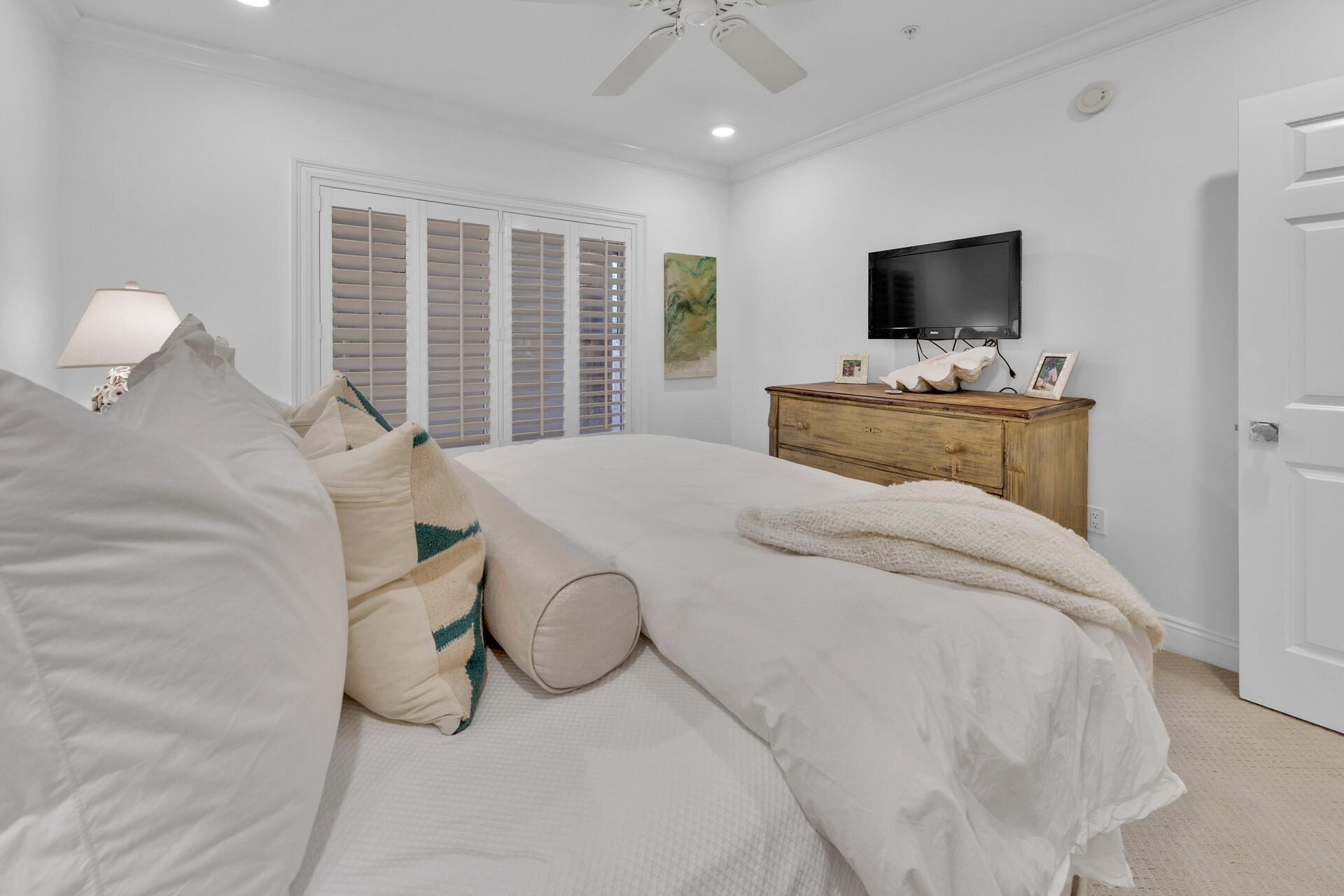 56 Blue Mountain Road, Unit B105 Santa Rosa Beach, FL 32459 - Photo 29 of 49 a bedroom with a bed and a flat screen tv