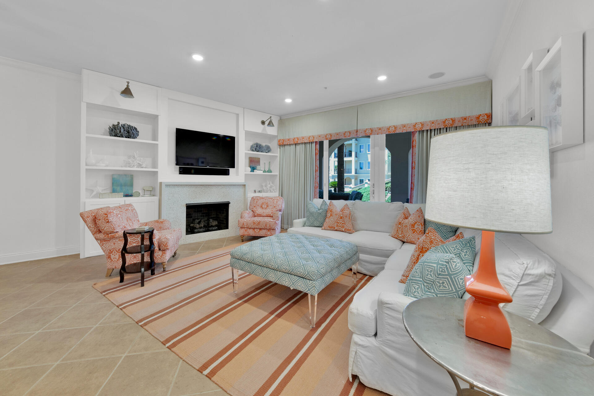 56 Blue Mountain Road, Unit B105 Santa Rosa Beach, FL 32459 - Photo 4 of 49 a living room with furniture a flat screen tv and a fireplace