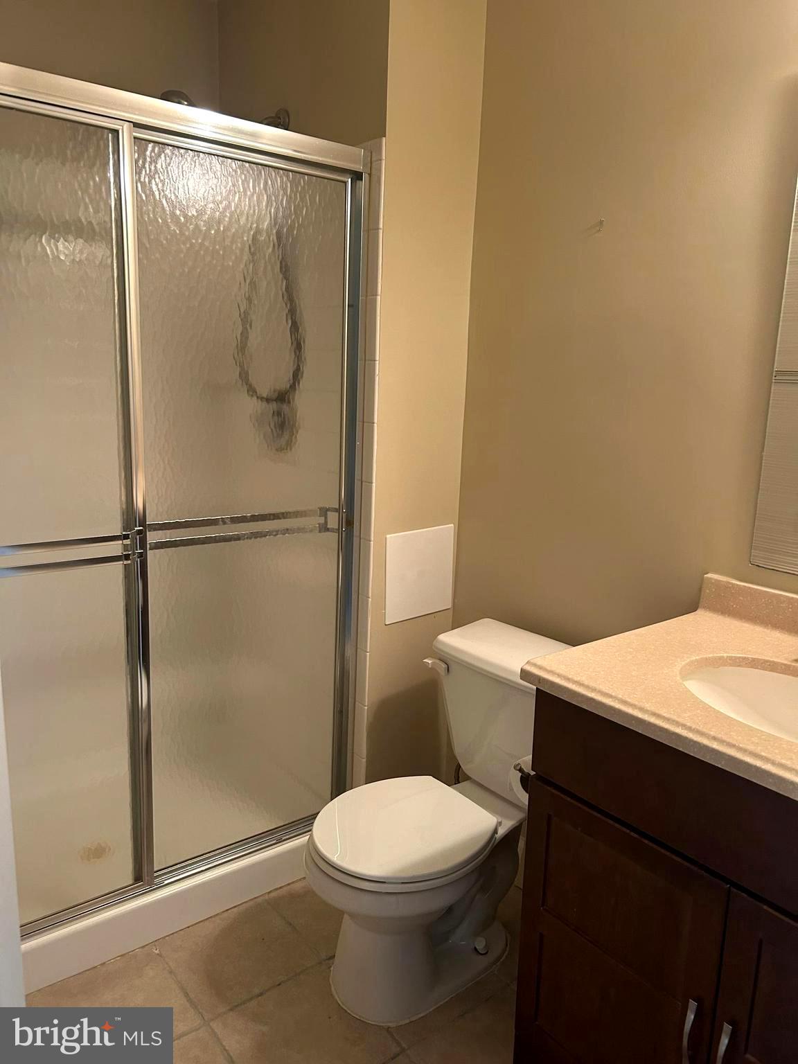 4658 Buckhorn Ridge Fairfax, VA 22030 - Photo 28 of 35 a white toilet sitting next to a shower