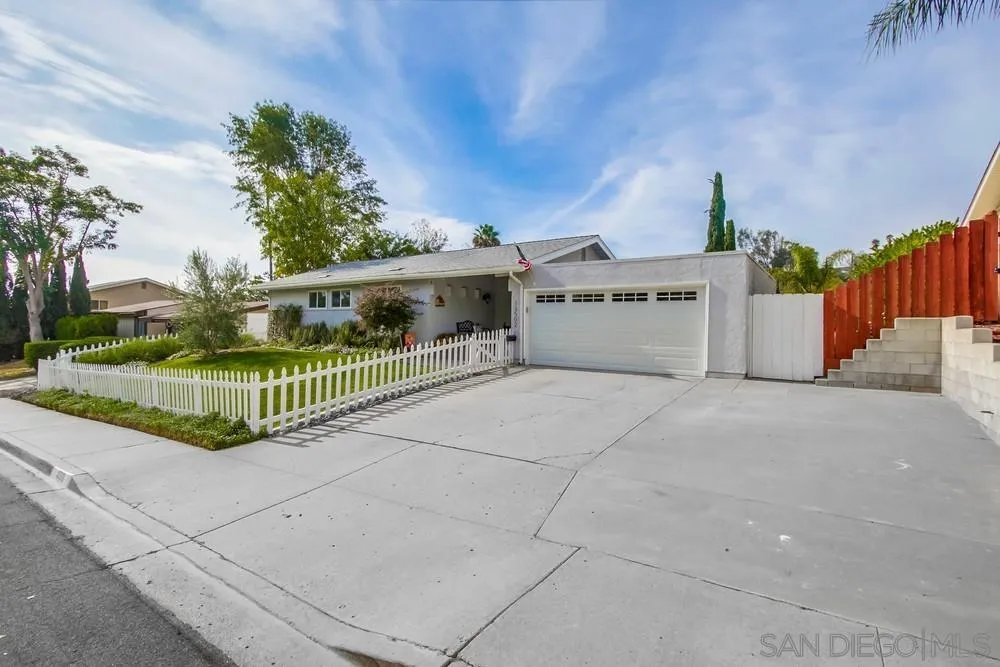 13502 Carriage Road Poway, CA 92064 - Photo 3 of 45 a view of a house with a wooden fence