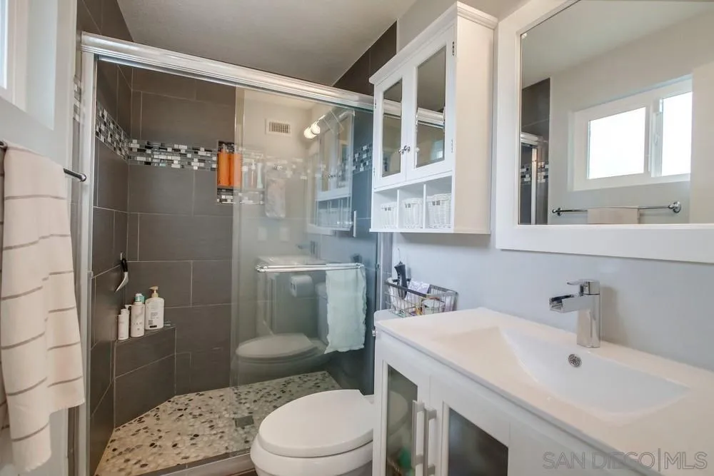 13502 Carriage Road Poway, CA 92064 - Photo 32 of 45 a bathroom with a sink toilet and shower