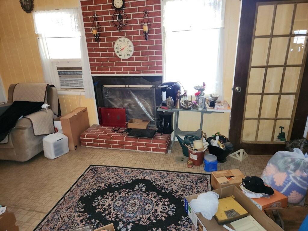 419 Fifth Street McLean, TX 79057 - Photo 14 of 34 a living room with furniture and a fireplace